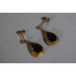 A Pair of 9 Carat Gold and Smoky Quartz Stud Earrings.