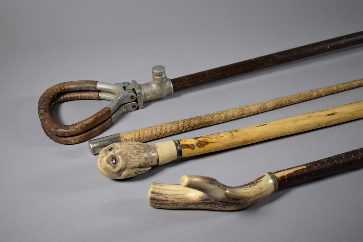 Two Walking Sticks, One with Bone Handle and Other with Owl Together with a White Metal Mounted Crop