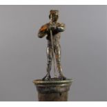 A Novelty Silver Plated Wine Saver Cork in the Form of Farmer with Rake, 8cm High.
