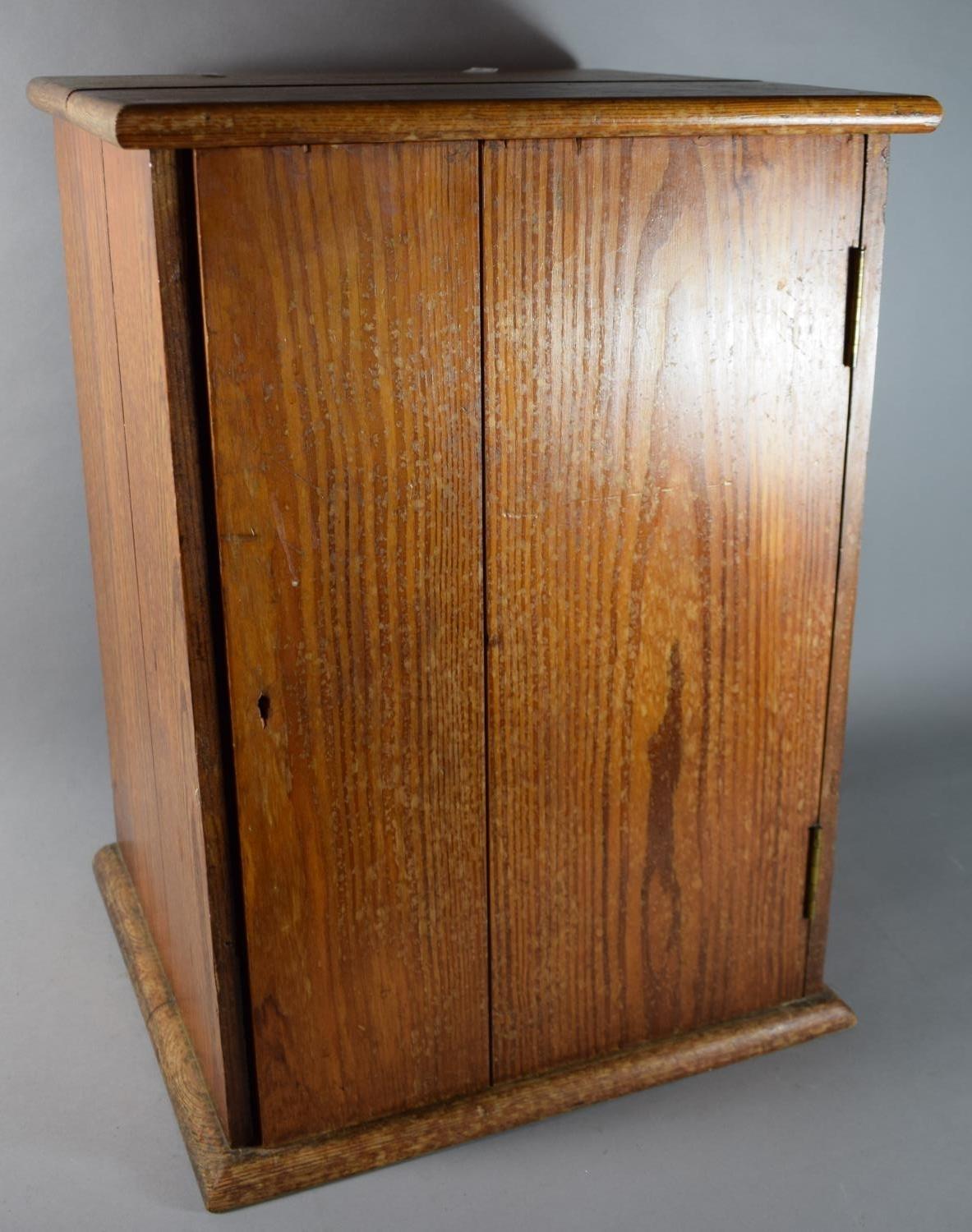 An Edwardian Pitch Pine Cabinet with Inner Drawer and Shelf, 42cms Wide, 57cms High