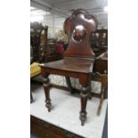 A Victorian Mahogany Shield Back Hall Chair