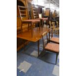 A 1970's McIntosh Teak Dining Table and Four Chairs