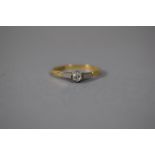 An 18 Carat Gold and Diamond Solitaire Ring with Platinum Shoulders, Size P, 2.5gms