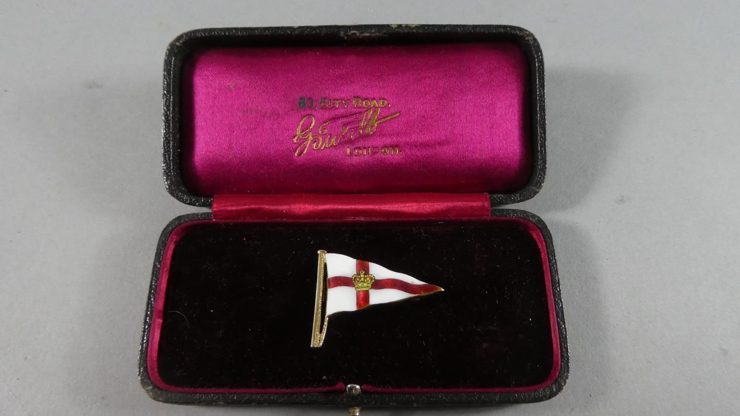 An Enamelled Silver Gilt Brooch in the Form of St. George's Flag with Crown at Centre.