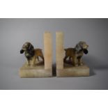 A Pair of Alabaster Book Ends, with Cold Painted Spelter Mounts of Spaniels, 12cms High