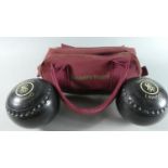 A Pair of Taylor "Lignoid" Lawn Bowls in Canvas Carrying Bag Inscribed 'Drakes Pride'