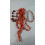 A Coral Necklace, Coral Bead Bracelet and a Cherry Amber Bracelet