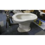 A Vintage Style White Glazed Bidet with Brass Taps