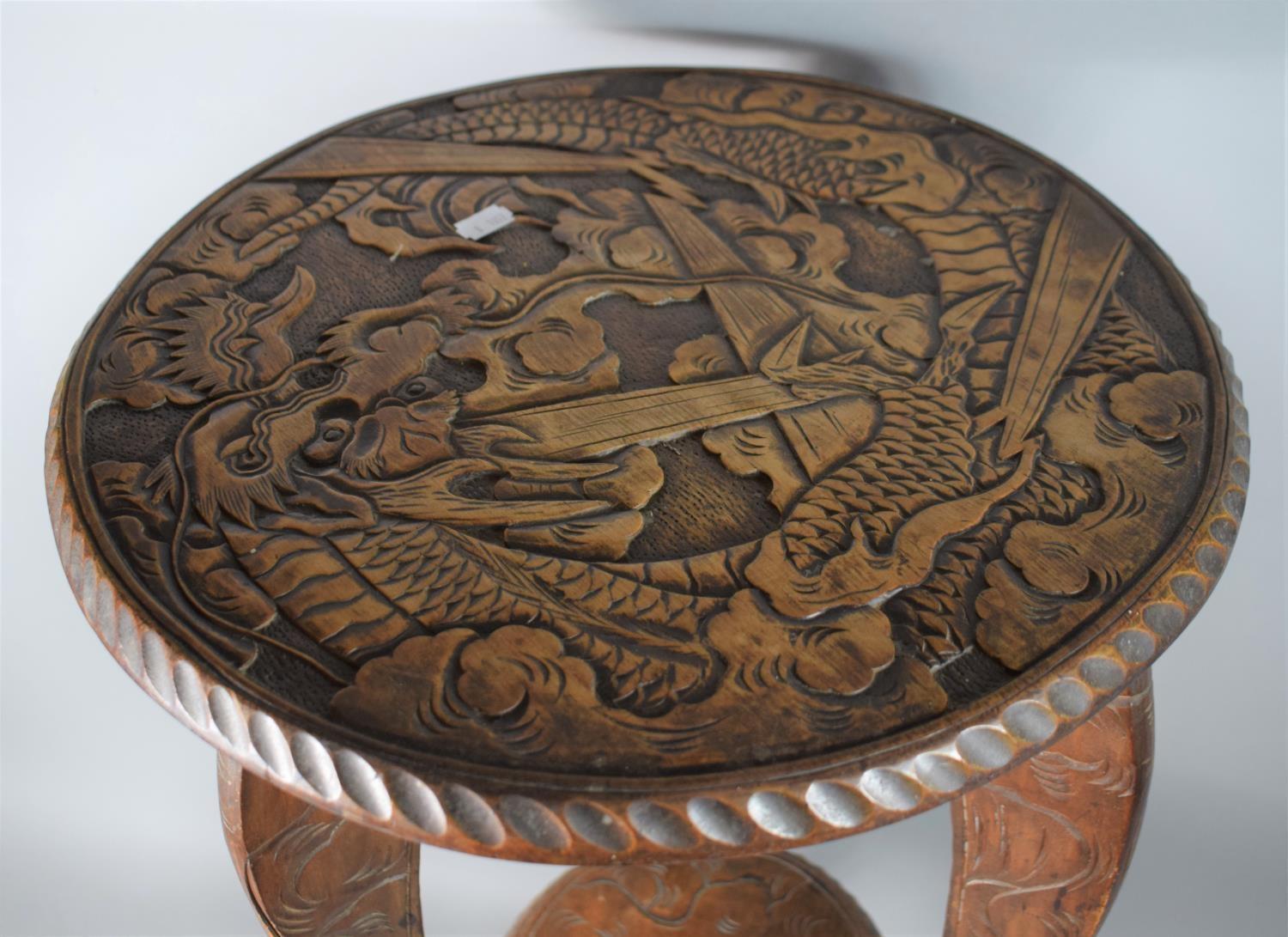 An Early 20th Century Carved Wooden Oriental Circular Topped Table Decorated with Dragon, 44cms Diam - Image 3 of 3