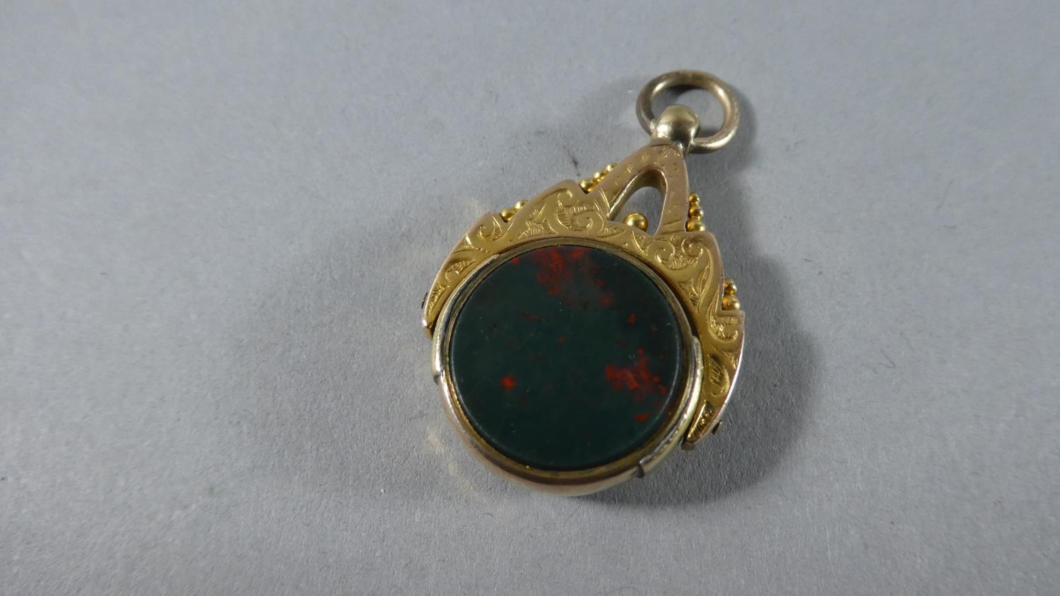 A 9 Carat Gold Fob Set with Bloodstone and Carnelian. Total Gross Weight - 7.3gms