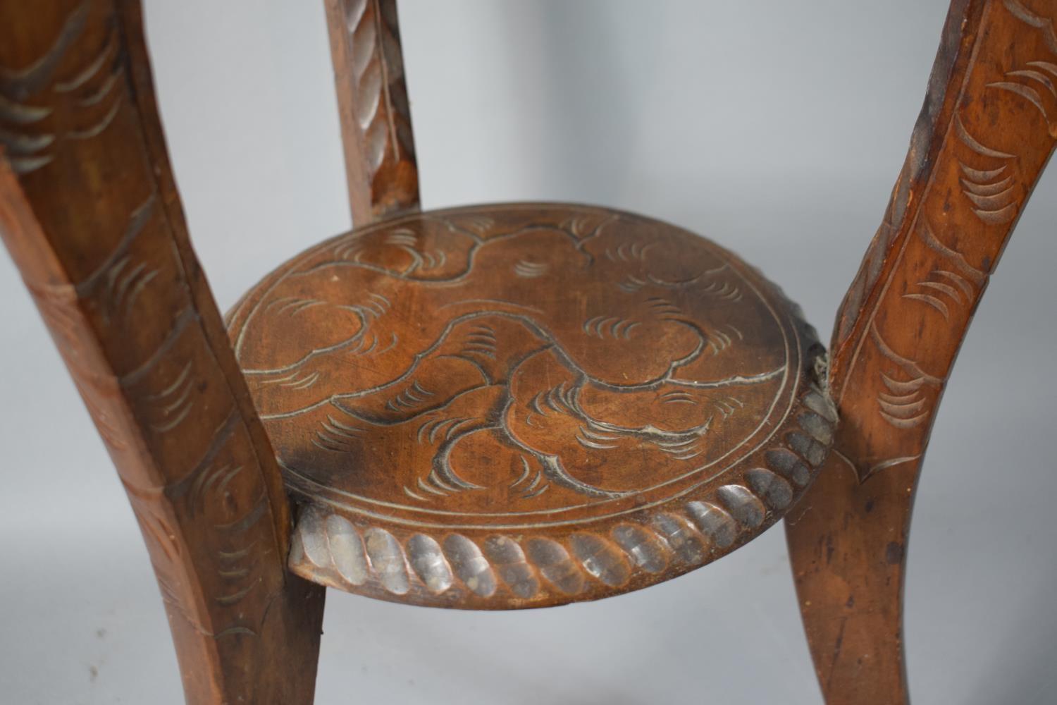 An Early 20th Century Carved Wooden Oriental Circular Topped Table Decorated with Dragon, 44cms Diam - Image 2 of 3