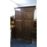 An Edwardian Mahogany Wardrobe with Panelled Doors, 110cms Wide