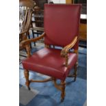 An Edwardian Oak Framed Leather Upholstered Gents Armchair with Acanthus Carving Scrolled Arms and X