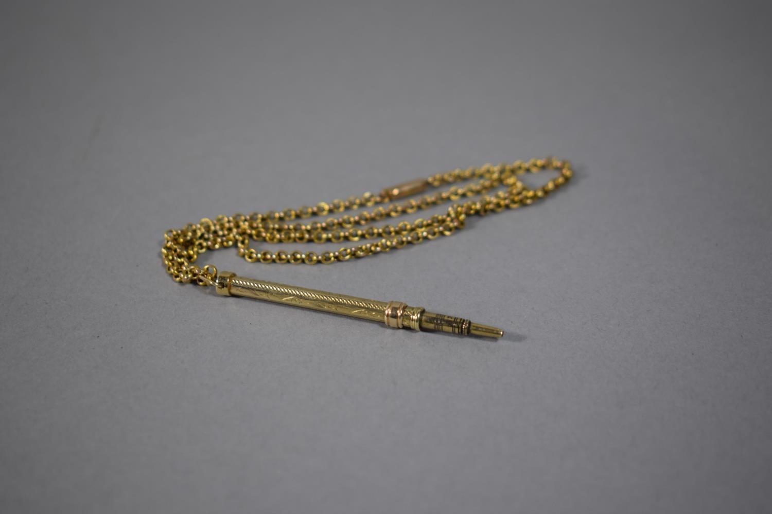 A Yellow Metal Propelling Pencil on 9 Carat Gold Chain, 6.9gms