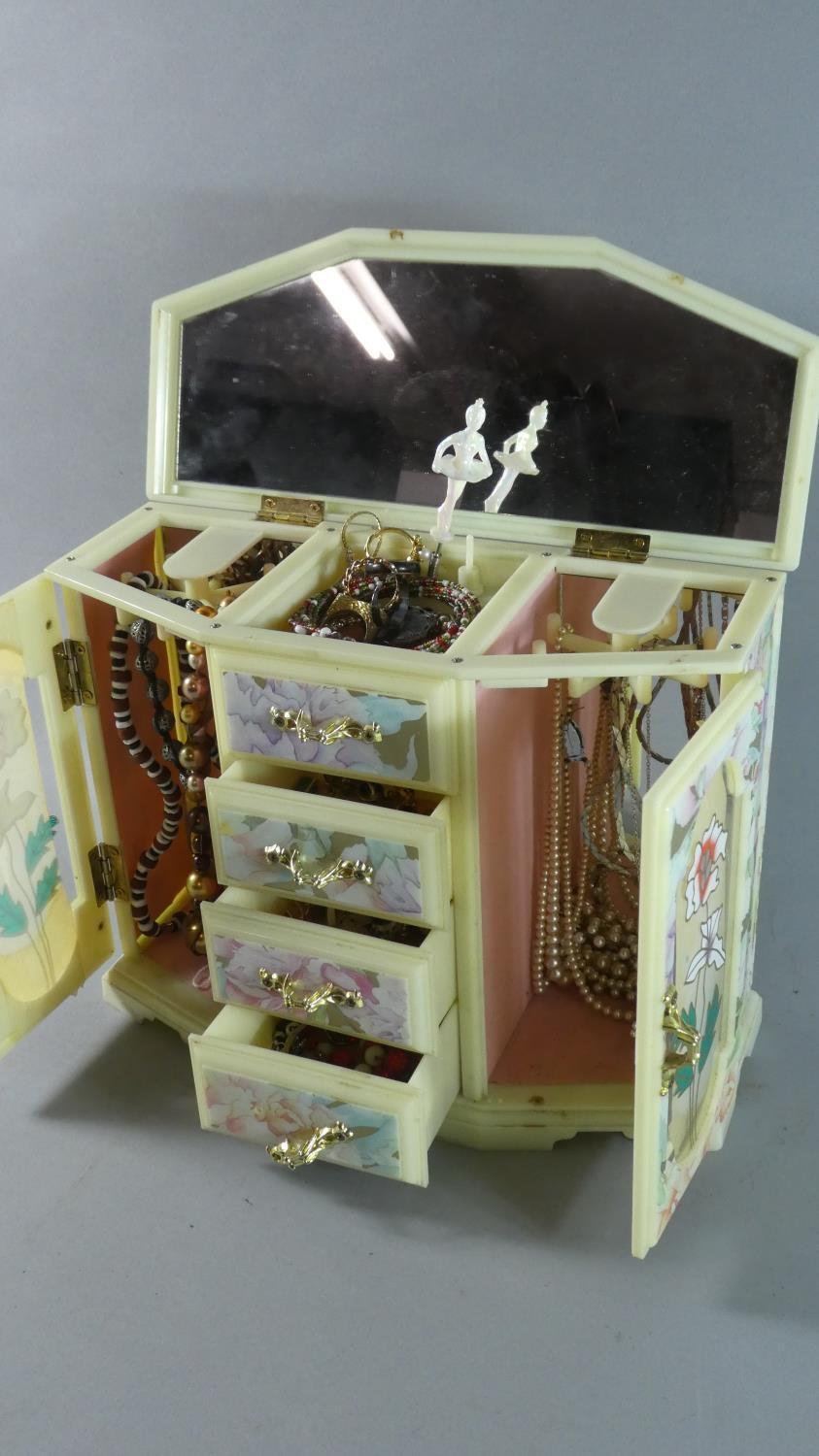 A 1960's Plastic Musical Jewellery Box Containing Costume Jewellery, 28cms Wide - Image 2 of 2