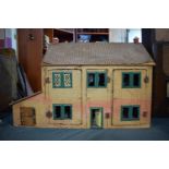 An Early 20th Century Wood and Tin Plate Dolls House for Renovation and Restoration. Some