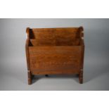 An Edwardian Oak Magazine Rack with Rear Drop Leaf, 45cms Wide