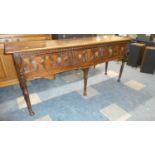 A 19th Century Jacobean Style Oak Three Drawer Dresser Base with Fielded Drawers Having Brass Lion