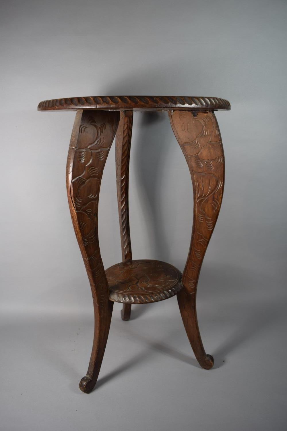 An Early 20th Century Carved Wooden Oriental Circular Topped Table Decorated with Dragon, 44cms Diam