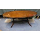 An Oval Mahogany String Inlaid Coffee Table, 121cms Wide
