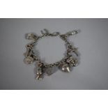 A Silver Charm Bracelet, Chain 19cms, 17.9g