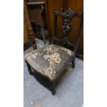 A Late Victorian / Edwardian Ebonised and Carved Ladies Nursing Chair