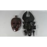 Two Tribal Masks, One Possibly Fang