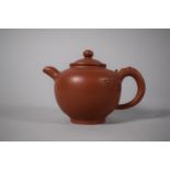 A Yixing Teapot with Floral Decoration in Relief, Seal Mark to Base, 10cms High