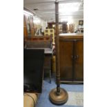 An Edwardian Oak Standard Lamp with Barley Twist Support and Circular Base