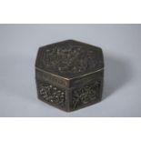 A Chinese Silver Hexagonal Box Decorated in Relief with Foliate Panels to Each Facet and Lid with