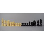 An Early 20th Century Natural and Black Stained Ivory Chess Set, in Wooden Box, Kings 7.5cms High