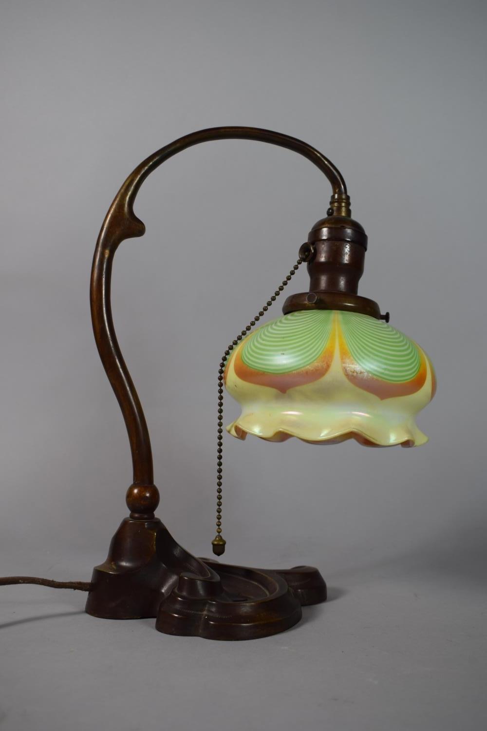 An Art Nouveau Bradley Hubbard Bronze Table Lamp with a Steuben Glass Shade Having Green Drape