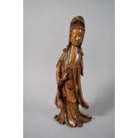 A Chinese Carved Hardwood Figure of Guanyin, 39cms High