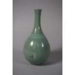 A Korean Celadon Crackle Glaze Bottle Vase Decorated with Cranes and Clouds, Signed to Base