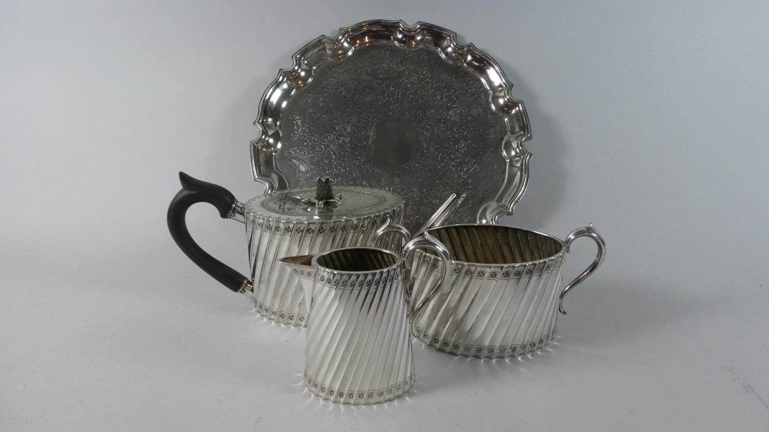 A Silver Plated Reeded Tea Set Comprising Teapot, Milk & Sugar - The Teapot with Pineapple Finial