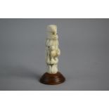 A 19th Century Carved French Ivory Novelty in the Form of Seated Metamorphic Monkey Wearing Cloak