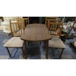 A Drop Leaf Kitchen Table and Four Spindle Back Chairs