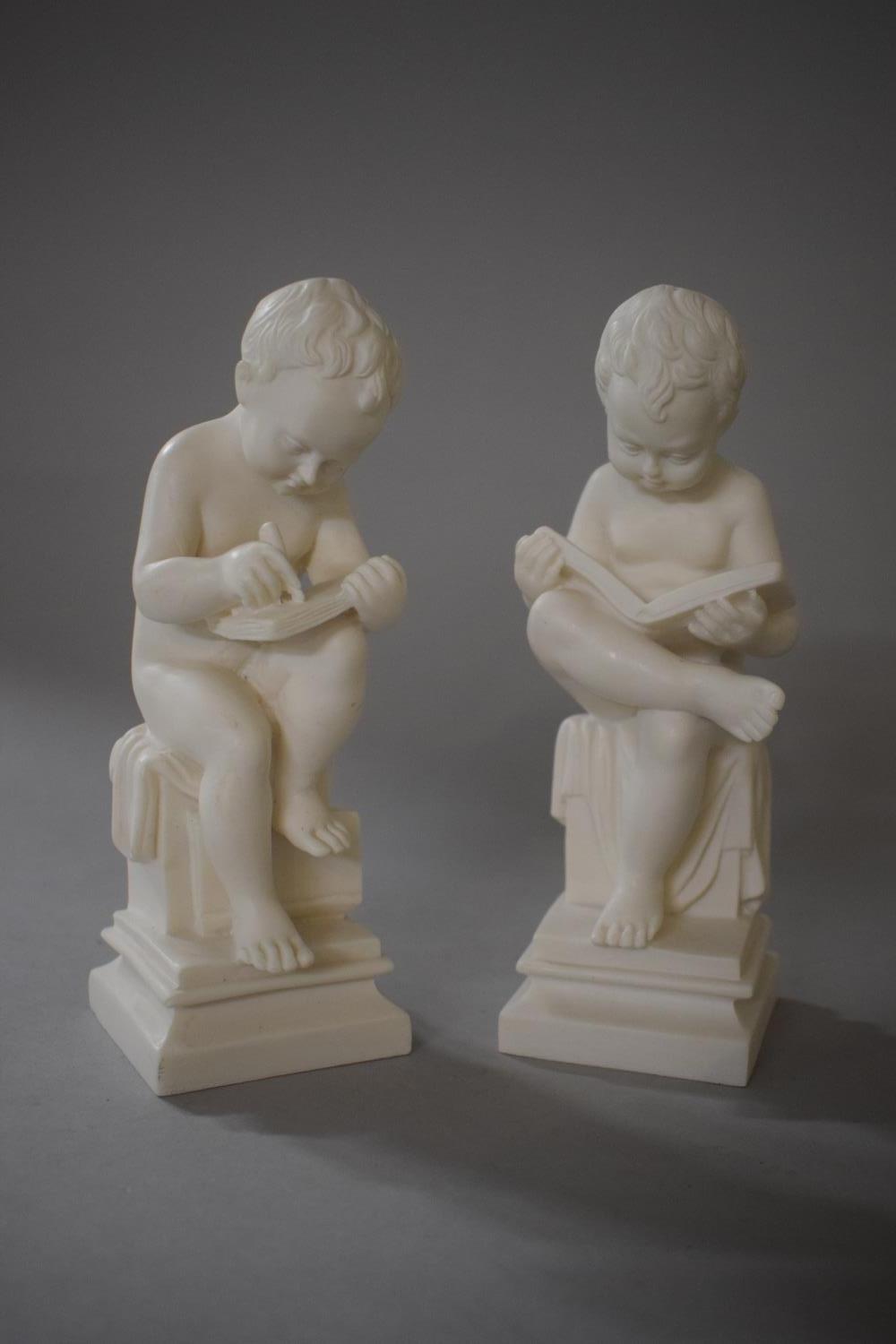 Two Resin Studies of Cherubs Reading and Writing, 19cms High
