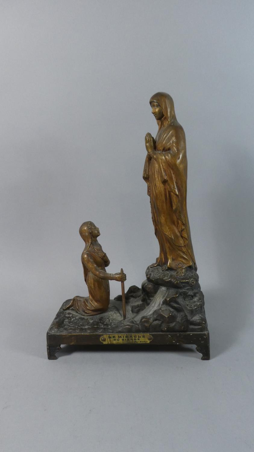 A French Bronze Effect Spelter Religious Group 'Le Miracle Du Cierge' After Richir, 38cms High