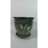 A Blue Glazed Planter with Incised Tulip Decoration and Drip Tray, 30cms Diameter