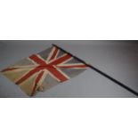 An Edwardian Cloth Union Jack (Faded and with Holes) on a Turned Wooden Flag Pole, 169cms Long