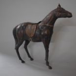 A Large Leather Work Study of a Saddled Horse, 61cms High