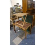 A Vintage Table with Folding Legs, a Notice Board and a Small Folding Table