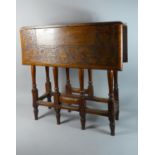 An Edwardian Oak Drop Leaf Gate Leg Table with Carved Border and Centre Panel, 73cms Long