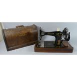 A Cased Singer Sewing Machine