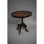 A Reproduction Oval Mahogany Galleried Wine Table