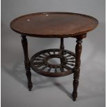 An Edwardian Mahogany Lazy Susan Circular Topped Table with Spindle Wheel Stretcher by Daniell &