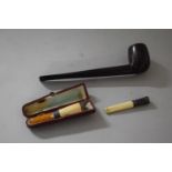 A Silver Mounted Cheroot Holder Together with a Cased Amber Example (AF) and a Pipe