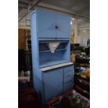 A 1950's Painted Wooden Kitchen Cabinet with Enamel Slide Over Four Drawers and Cupboard Raised