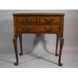 A Reproduction Lowboy with Two Short and One Long Drawers, on Cabriole Supports, 68cms Wide